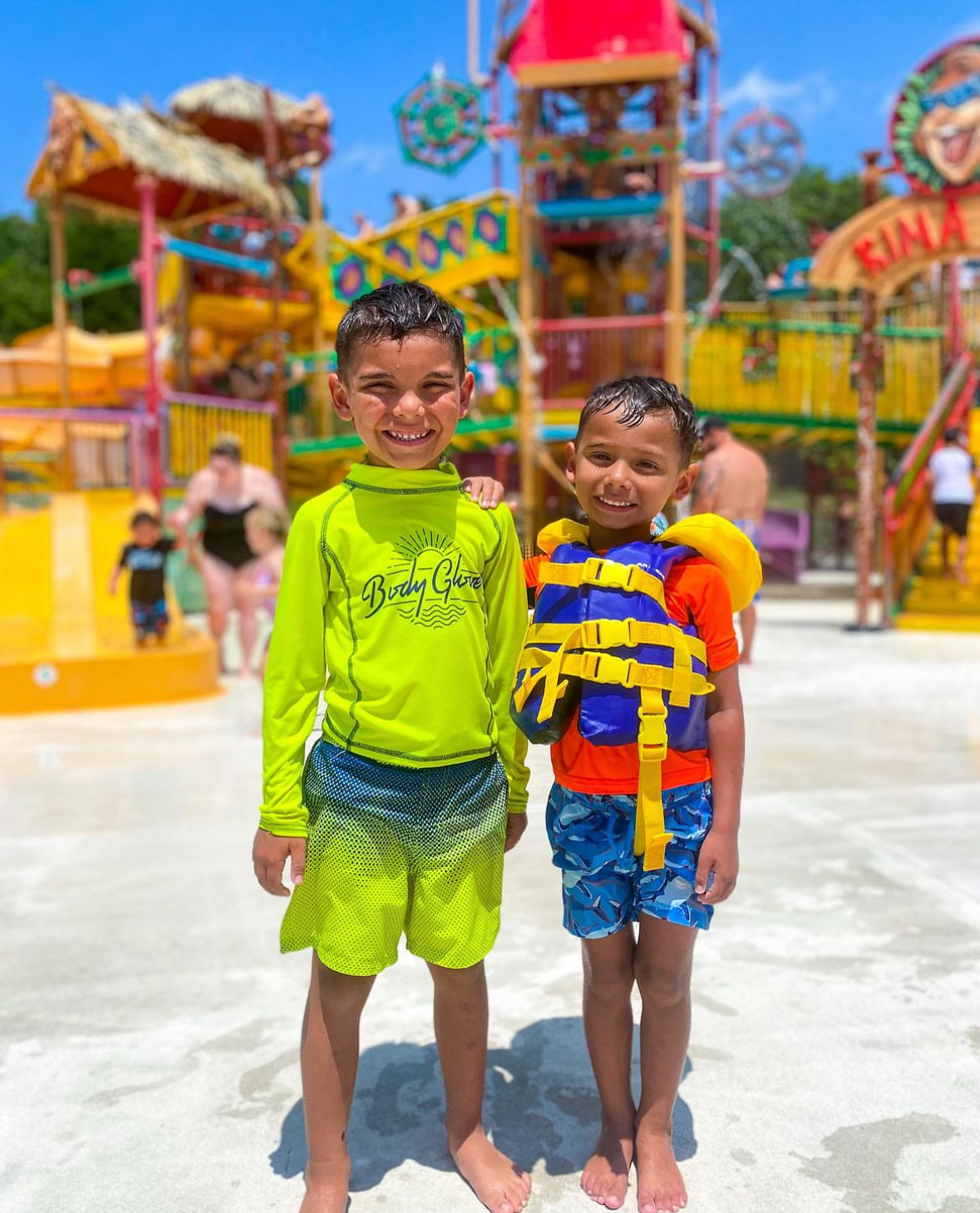 Brothers pose for a photo in front of Kima Bay