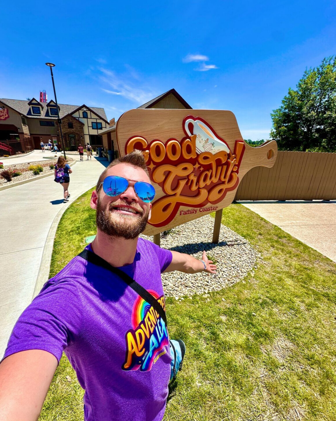 A man takes a selfie in front of the Good Gravy! sign