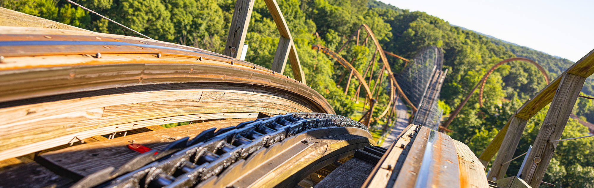 The view from the top of The Voyage roller coaster's lift hill. You can see other hills as well as Thunderbird roller coaster in the distance.