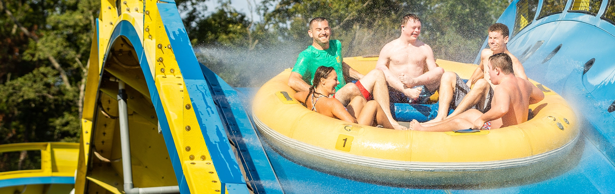 A boat full of happy riders on Mammoth water coaster.