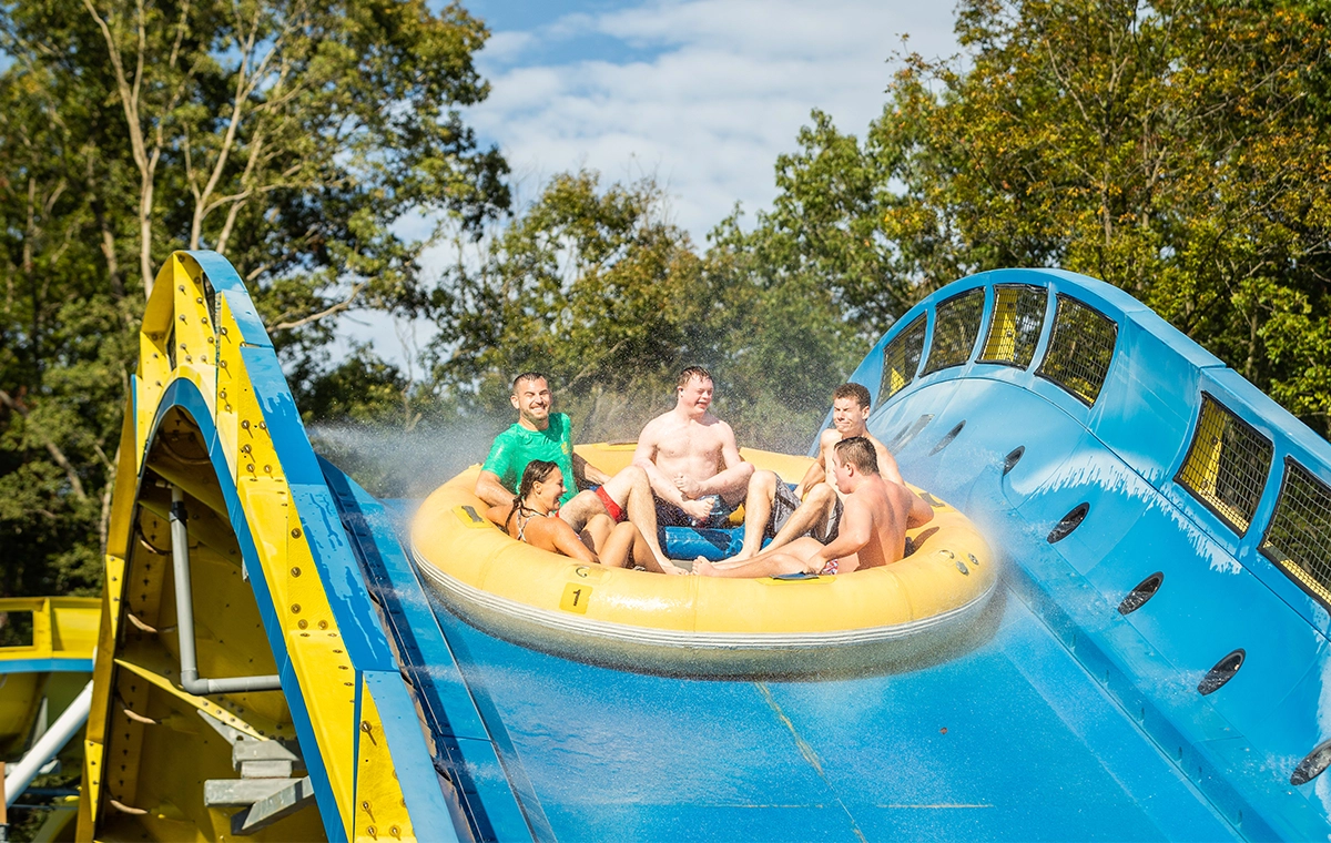 A boat full of happy riders on Mammoth water coaster.
