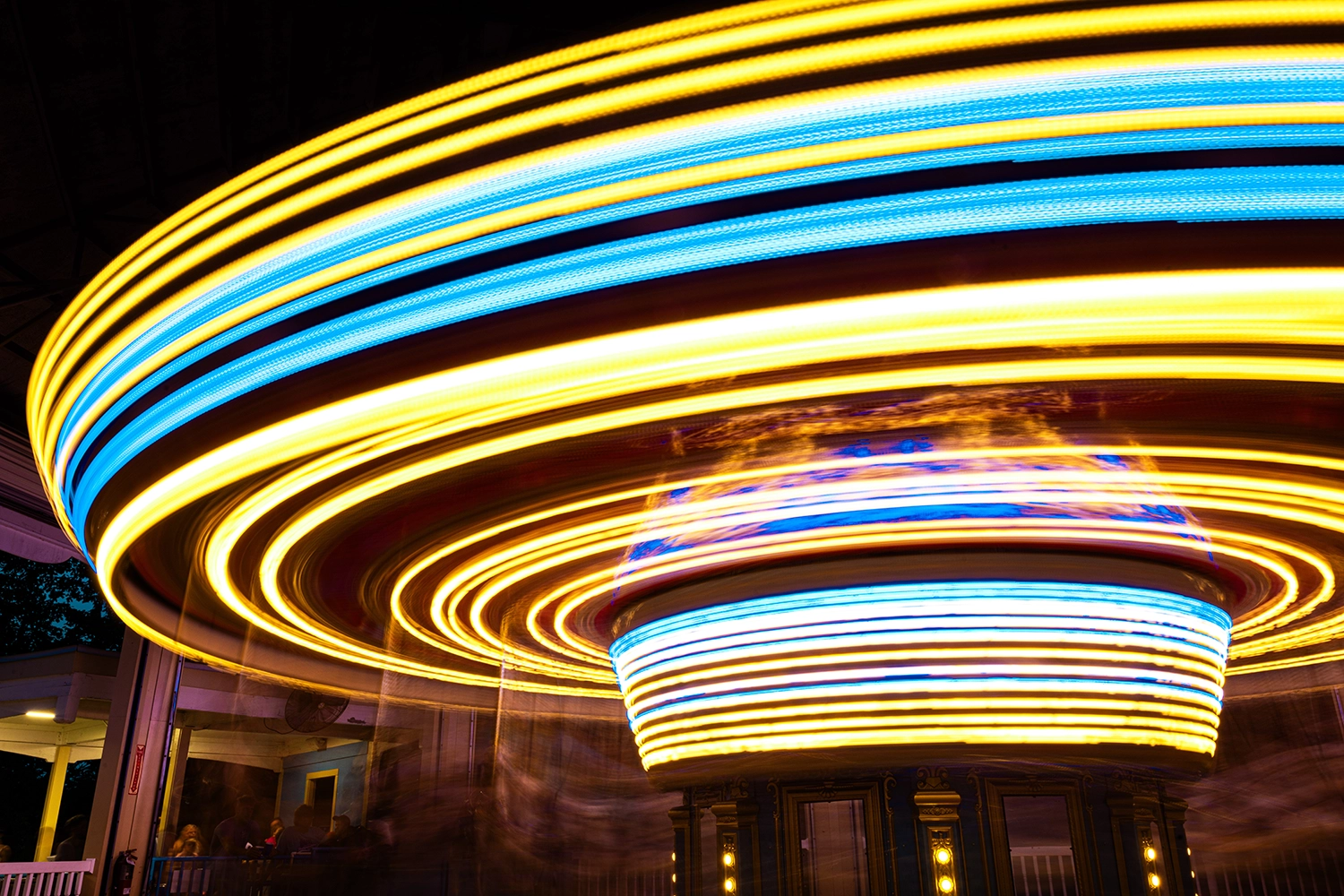 Long exposure of Star Spangled Carousel showing off its patriotic light streaks at night.