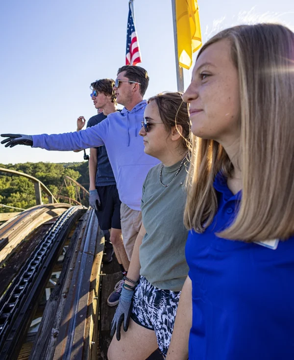 A group stands at the top of The Voyage's lift hill during the Earlybird Tour at Holiday World & Splashin' Safari in Santa Claus, Indiana.