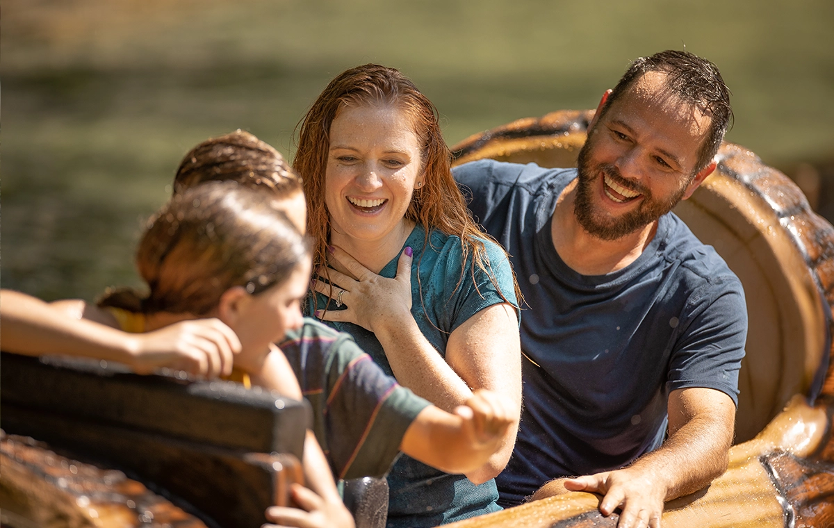 Mom looks like she's catching her breath as she rides Frightful Falls with her family at Holiday World & Splashin' Safari in Santa Claus, Indiana.