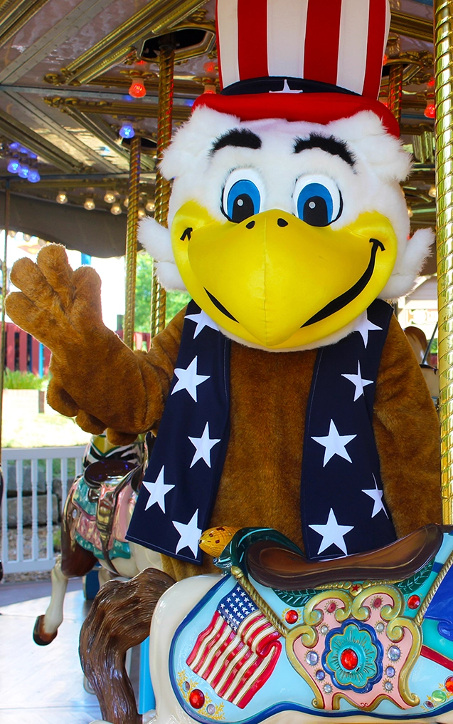 George the Eagle poses and waves on the Star Spangled Carousel