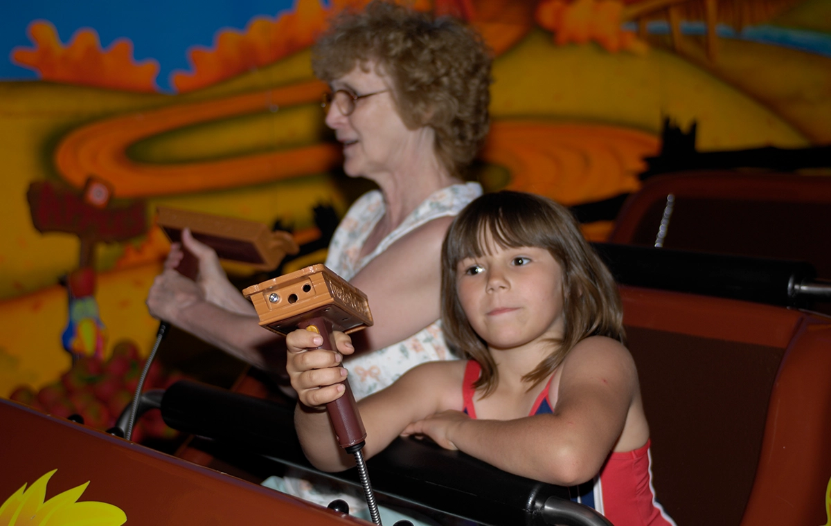 A grandmother and grand daughter ride together through Gobbler Getaway at Holiday World & Splashin' Safari in Santa Claus, Indiana.