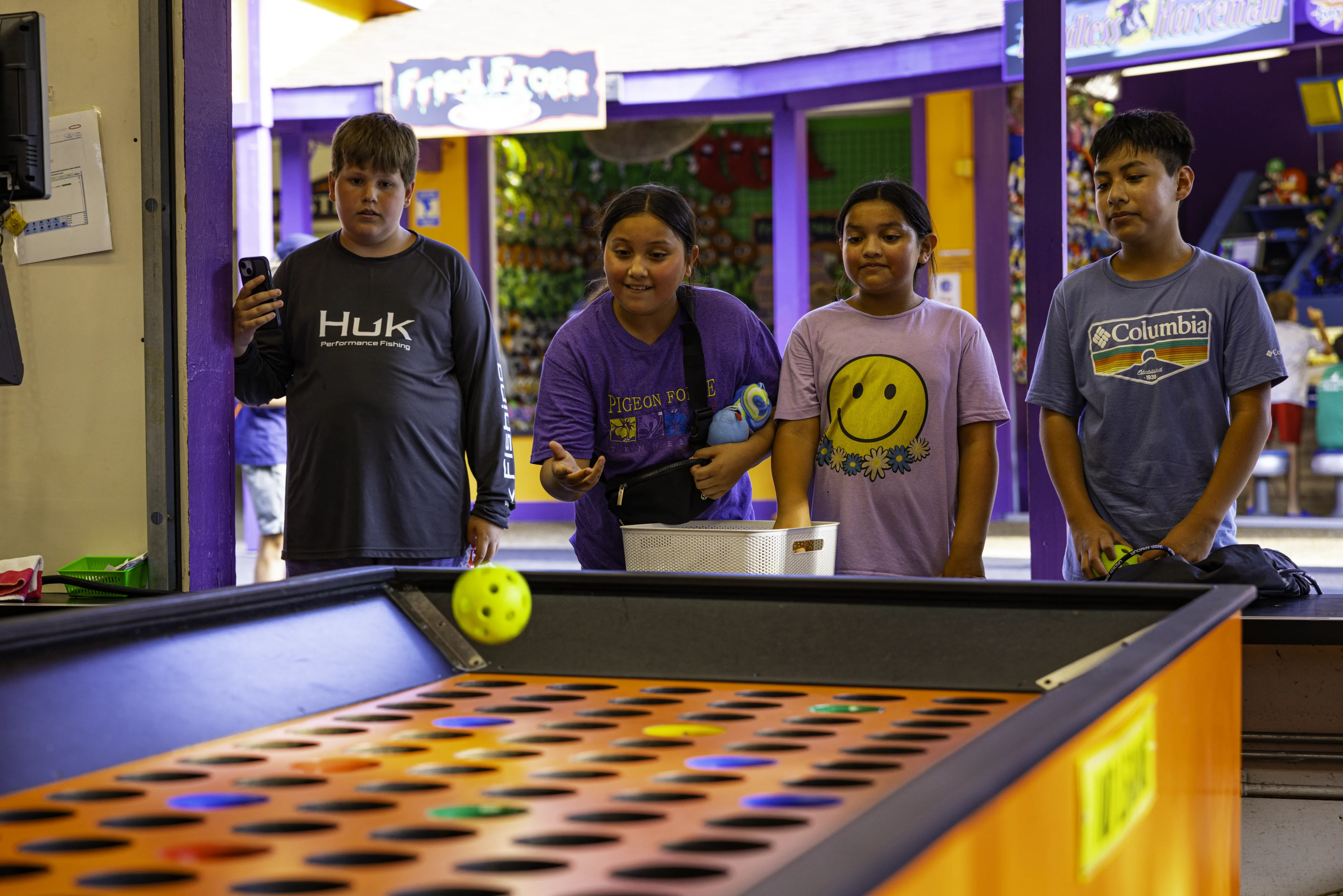 Balls resting in the goblet pitch game, Goblin's Goblet Pitch, at Holiday World.