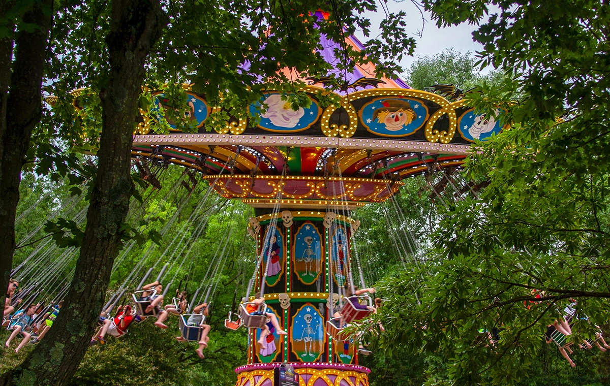 Looking at HallowSwings through the trees at Holiday World & Splashin' Safari in Santa Claus, Indiana.