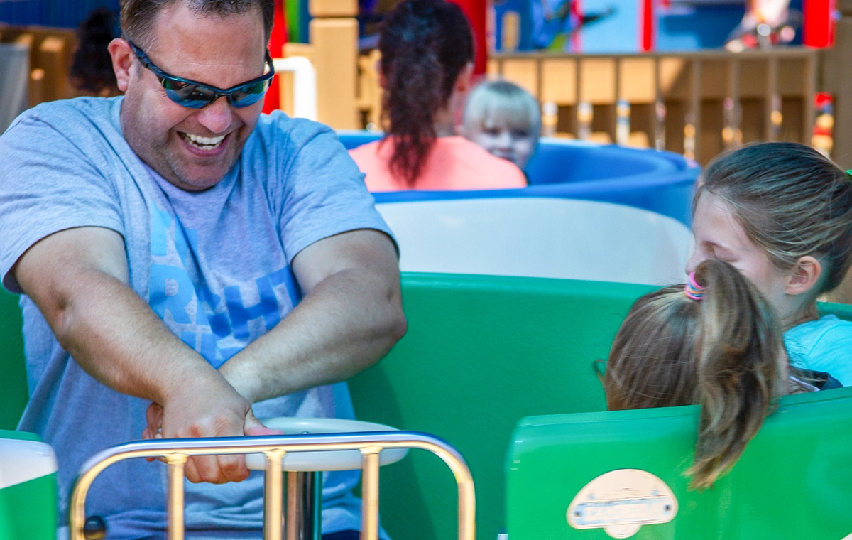 Dad spinning the tea cup on Kitty's Tea Party at Holiday World & Splashin' Safari in Santa Claus, Indiana.