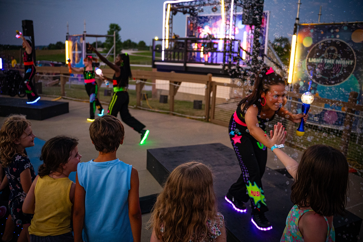 Guests enjoying Light the Night DJ Dance Party prior to Holidays in the Sky.