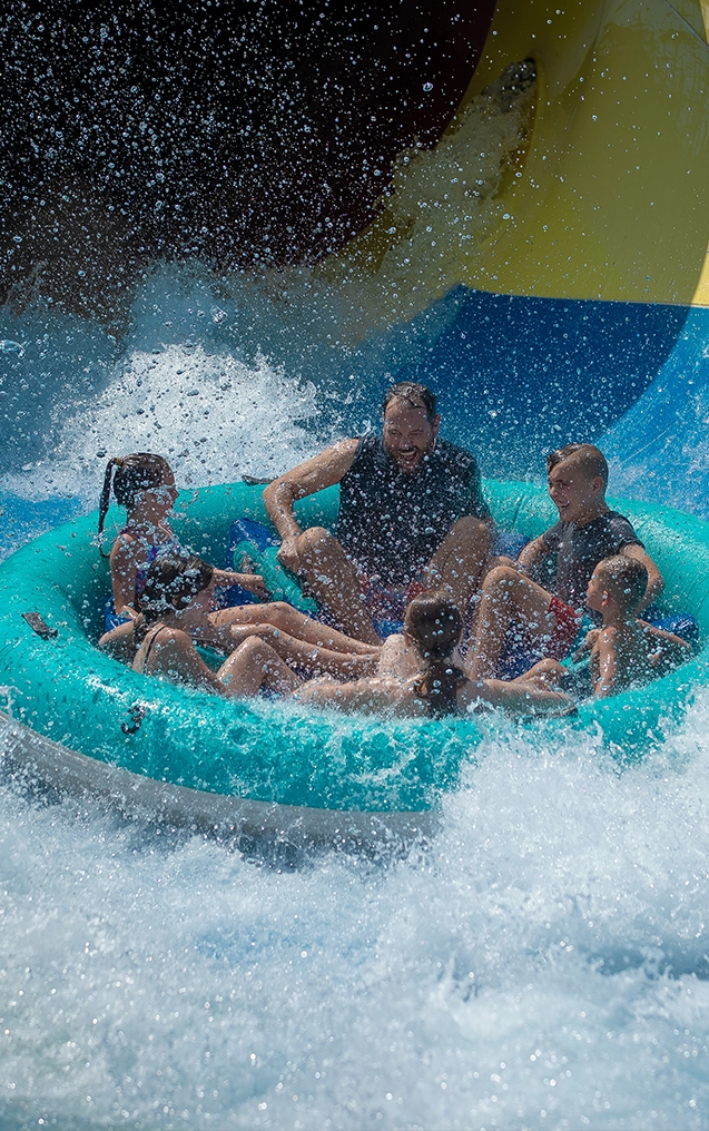 A group of riders splashes down on Mammoth in Splashin' Safari.
