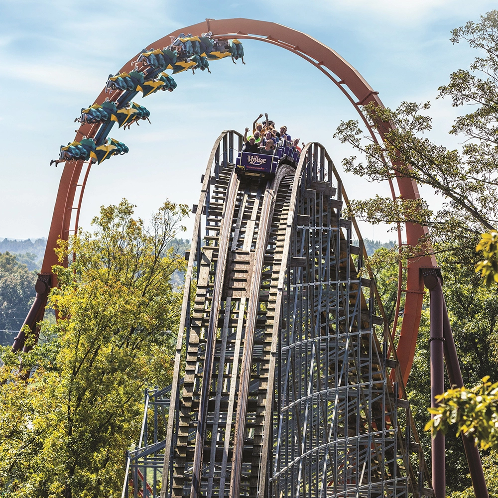 Thunderbird Steel Roller Coaster and The Voyage Wooden Roller Coaster trains sync up for an epic shot of the two coasters at Holiday World & Splashin' Safari in Santa Claus, Indiana