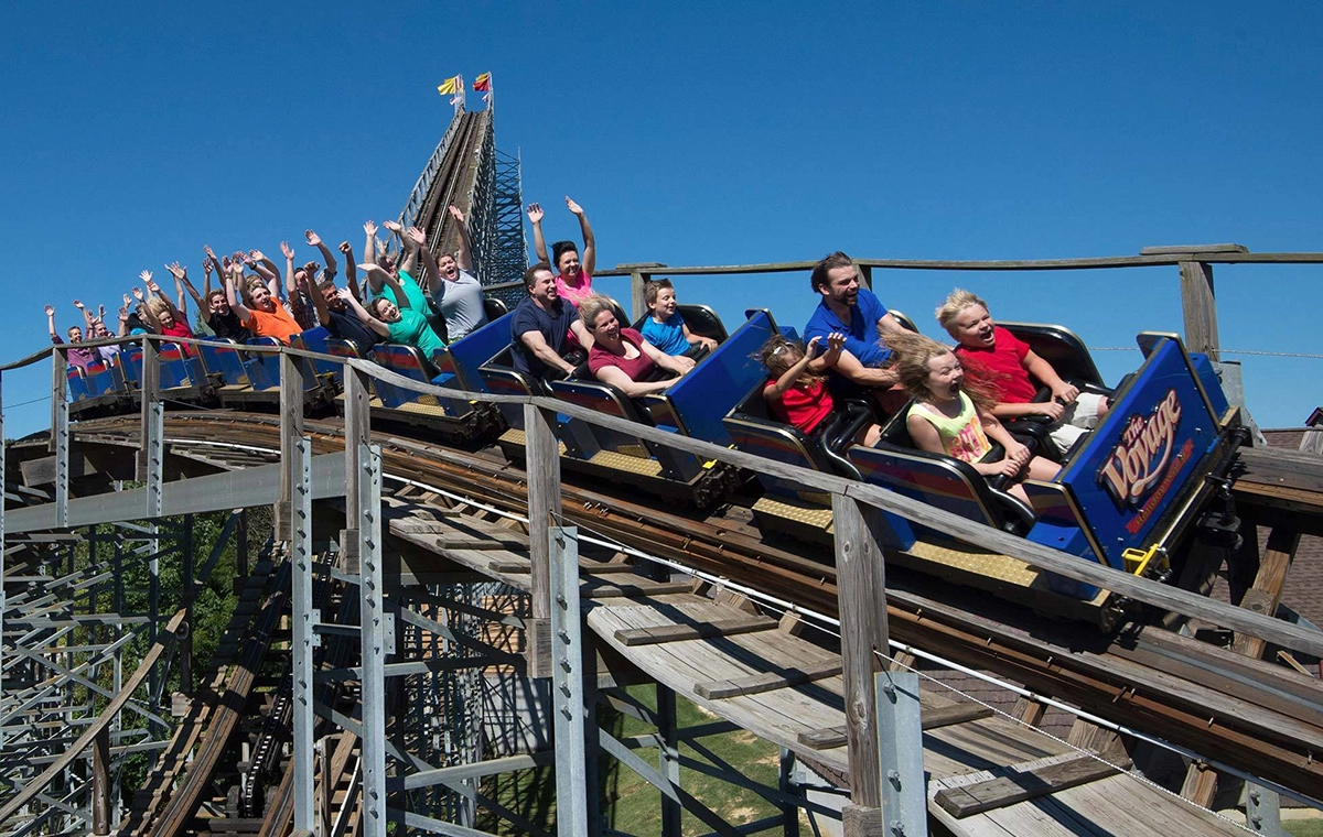 Closeup of a train speeding by on The Voyage Wooden Roller Coaster at Holiday World & Splashin' Safari in Santa Claus, Indiana