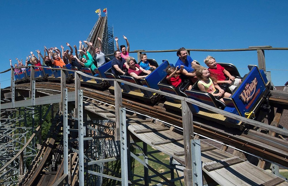 Closeup of a train speeding by on The Voyage Wooden Roller Coaster at Holiday World & Splashin' Safari in Santa Claus, Indiana